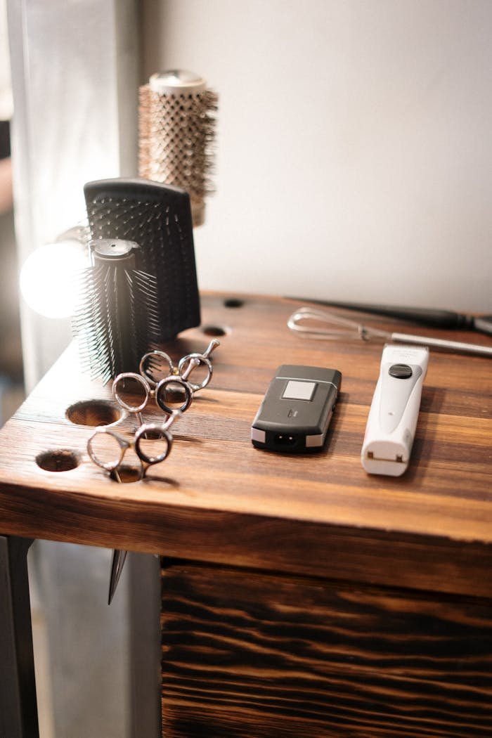 who-we-are-img Barber tools on a wooden table in a hair salon, ready for use.